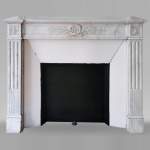 Louis XVI style fireplace in Carrara marble with a laurel crown