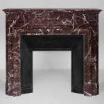 Mantel with an acroterion in Levento marble 