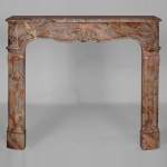 Beautiful Louis XV style mantel in Sarrancolin marble with a Rococo shell