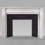 Louis XVI style mantel adorned with carved acanthus leaves, in statuary marble