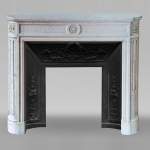 Louis XVI style mantel with a sunflower and curved sides in Carrara marble