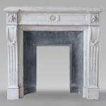 Small Louis XVI style fireplace in Carrara marble with a sunflower