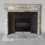 Louis XVI style mantel in Violet Breccia with a laurel crown