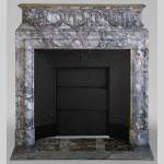 Fireplace with acroterion in Roman breccia of Baixas marble