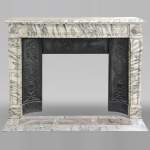 Louis XVI style fireplace with peals edges in veined Carrara marble