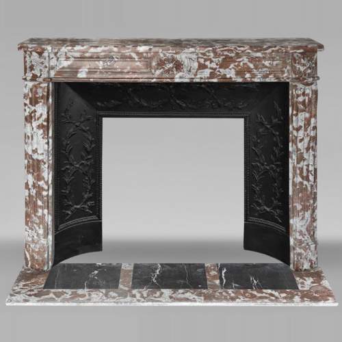 Slightly curved Louis XVI style fireplace, in Northern Red marble