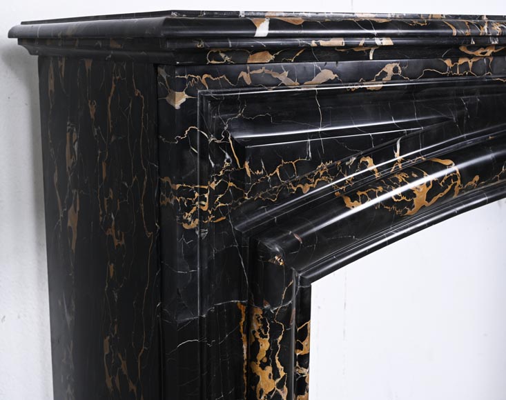 Louis XIV style fireplace in Portoro marble, with a molding and rounded frieze-3