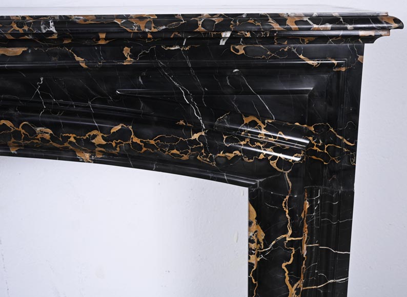 Louis XIV style fireplace in Portoro marble, with a molding and rounded frieze-6