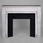 Louis XVI style mantel with pearls and ribbons carved in veined Carrara marble