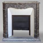 An antique Louis XV style fireplace, Pompadour model, made out of Bois Jourdan marble