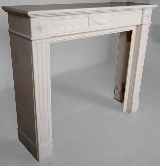 Louis XVI style fireplace in veined white marble decorated with a garland-2