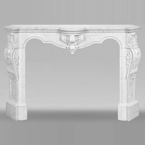A richly sculpted Carrara marble fireplace in the Napoleon III style, decorated with a lion's head.