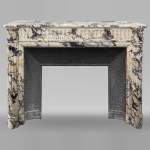 Louis XVI style fireplace with half-columns and rudenture in Violet Breccia