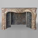 Exceptional Louis XV style fireplace in Rouge Royal marble with an asymmetrical shell
