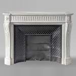 Louis XVI style curved Carrara marble mantel with floral rudenture