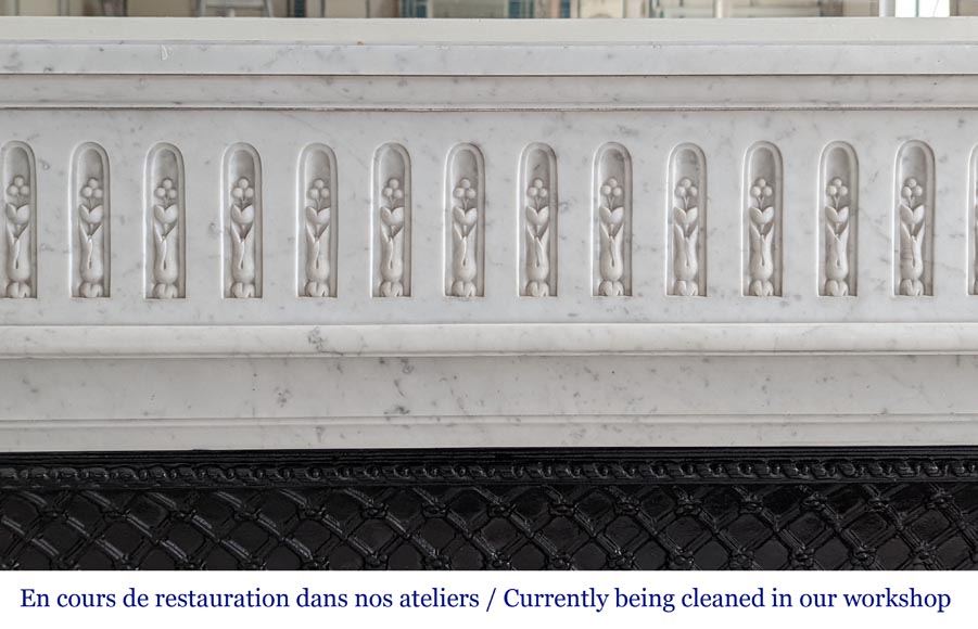 Large curved Louis XVI style fireplace with floral rudenture and acanthus leaf in Carrara marble-1