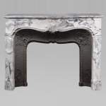 Louis XV style Arabescato marble mantel adorned with an asymmetrical palmette