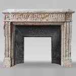 Louis XVI style mantel with rudendures carved in Sarancolin marble