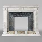 Louis XVI style mantel with carved rosette and fluted legs in Carrara marble