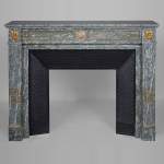 Louis XVI style mantel in vert d'Estours marble with gilded bronzes