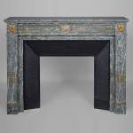 Louis XVI style mantel in vert d'Estours marble with gilded bronzes