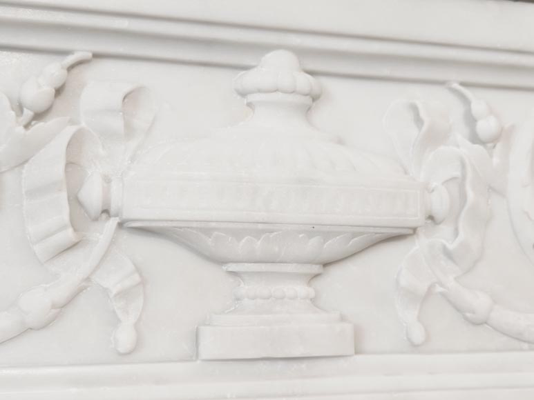 A Louis XVI style fireplace, richly decorated with garlands and vases, in Carrara marble A Louis XVI style fireplace, richly decorated with garlands and vases, in Carrara marble-2