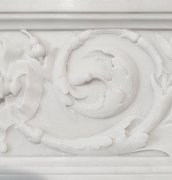 A Louis XVI style fireplace, richly decorated with garlands and vases, in Carrara marble A Louis XVI style fireplace, richly decorated with garlands and vases, in Carrara marble-3