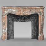 Louis XV style mantel in Rouge Royal marble