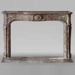 Louis XV period mantel in Rouge Royal marble
