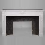 Large Louis XVI style mantel in semi-statuary marble with a vase decorated with garlands of flowers