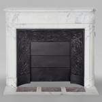 Louis XVI style mantel with rounded corners and sunflower in Arabescato marble