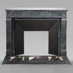 Louis XVI style fireplace with fluted entablature in dark Bleu Turquin marble