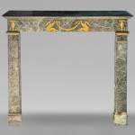Empire style mantel decorated with bronzes, in Vert de Mer marble