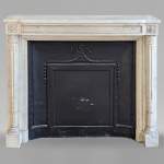 Louis XVI style mantel with half Corinthian columns and pearled frieze in statuary marble