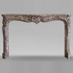 Louis XV style mantel in Rouge Royal marble, 18th century