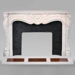 Louis XV style mantelpiece in Carrara marble with shells and flowers