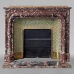Louis XIV style mantel in Rouge du Nord marble with brass insert