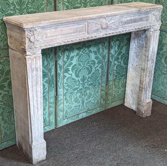 Louis XVI period stone mantel adorned with hunting figures and musical instruments-2