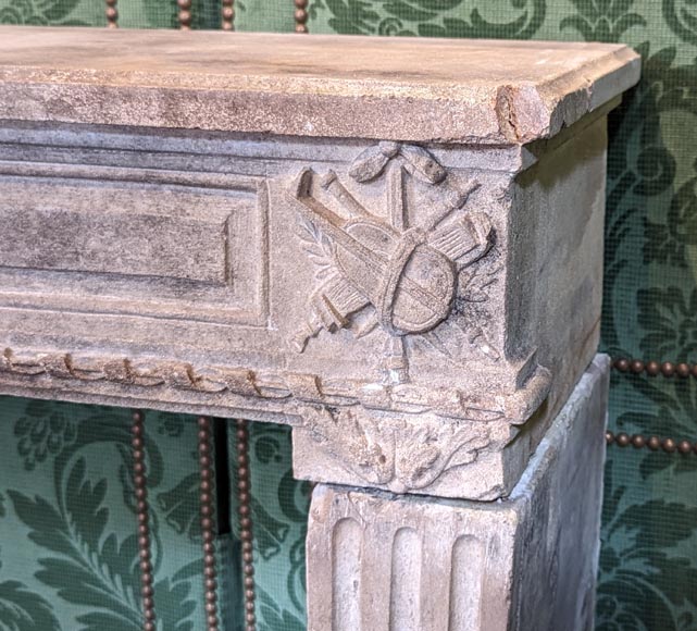 Louis XVI period stone mantel adorned with hunting figures and musical instruments-6