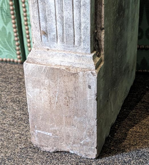 Louis XVI period stone mantel adorned with hunting figures and musical instruments-8