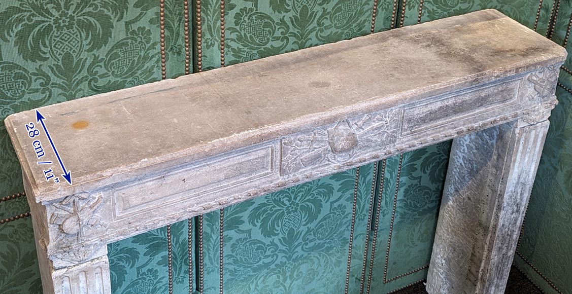 Louis XVI period stone mantel adorned with hunting figures and musical instruments-9