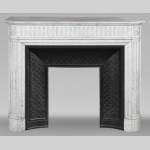  Louis XVI style fireplace in Carrara marble with rounded corners, decorated with rudenture
