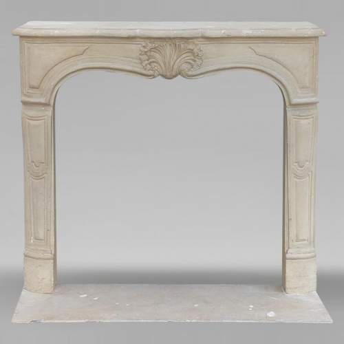 Louis XV style mantel adorned with a carved stone palmette