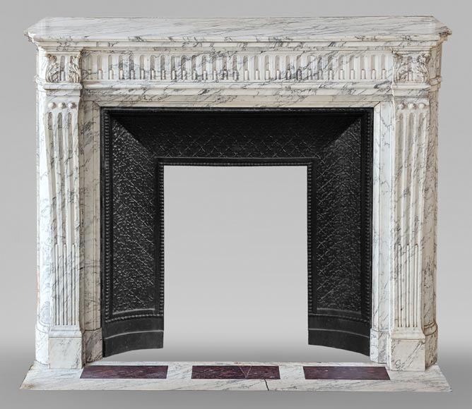 Louis XVI style mantel with curved flutes and carved capitals in highly veined Arabescato marble-0