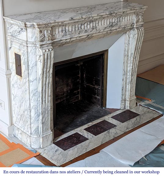 Louis XVI style mantel with curved flutes and carved capitals in highly veined Arabescato marble-2