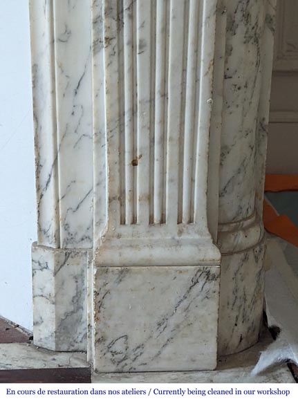 Louis XVI style mantel with curved flutes and carved capitals in highly veined Arabescato marble-10