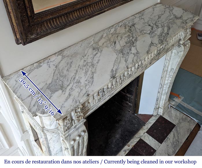 Louis XVI style mantel with curved flutes and carved capitals in highly veined Arabescato marble-12
