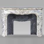 Large Regency-style mantel richly carved in violet breche marble