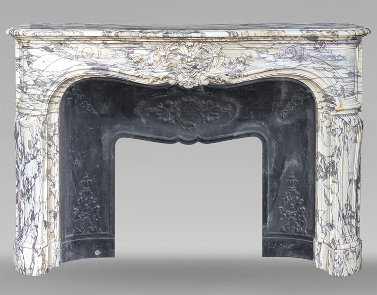 Large Regency-style mantel richly carved in violet breche marble-0