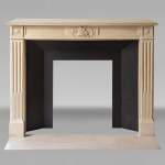 Louis XVI style stone mantelpiece with military trophy